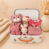 Little Indulgence luxury baby girl gift hamper with organic baby clothing, soft toys and keepsake suitcase.