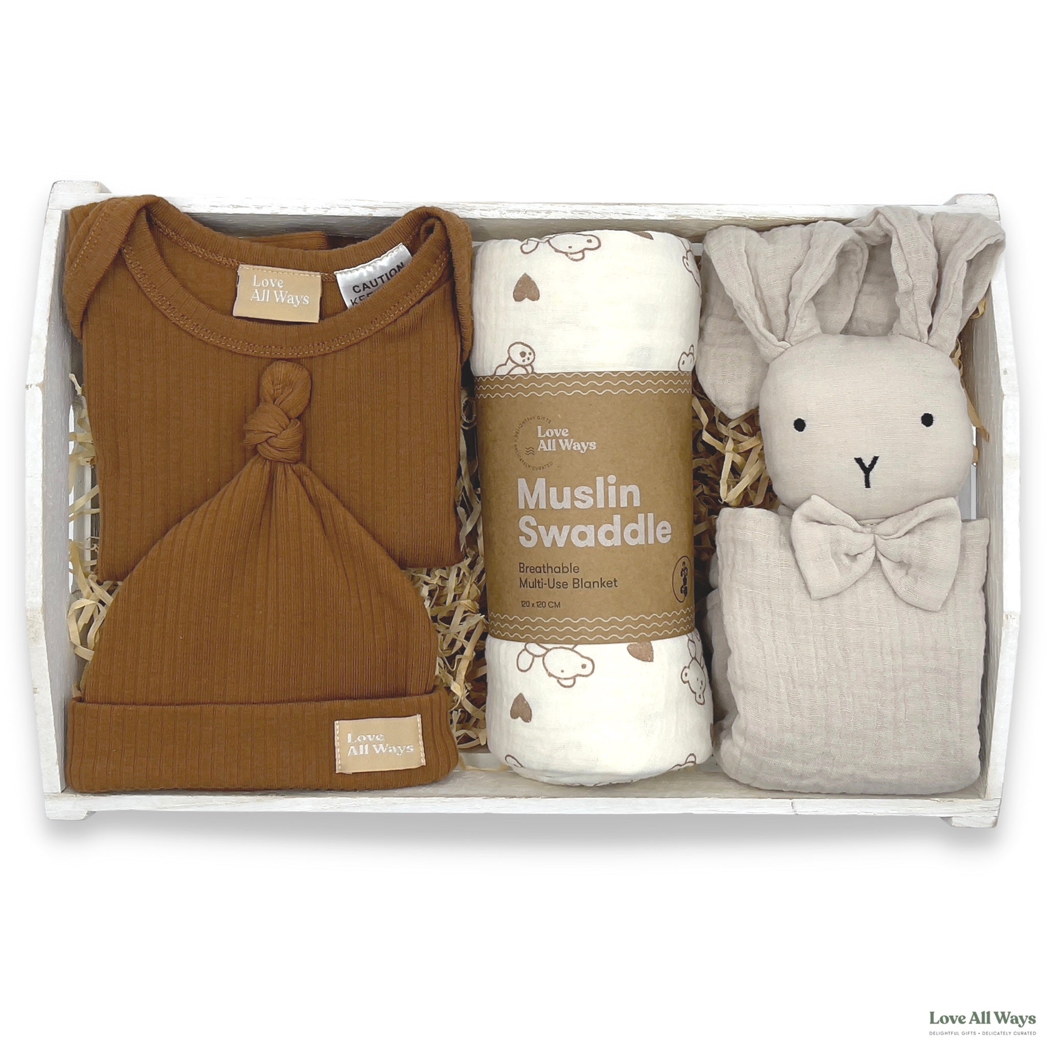 Neutral baby gift hamper highlighted by a natural, soft and breathable organic ribbed romper set, paired with some premium organic baby essentials making it the perfect gift.